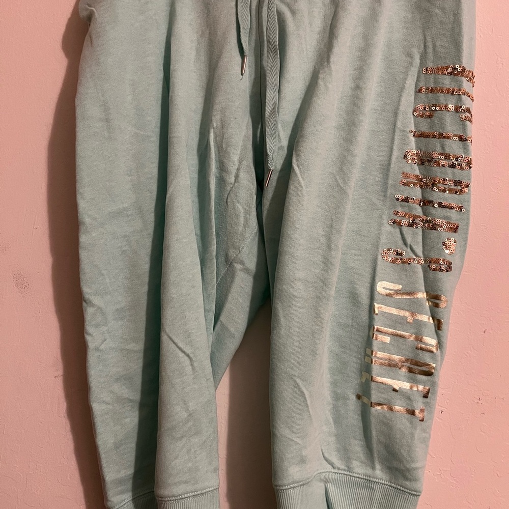 Victoria Secret zip up hoodie with capri bottoms.